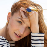 Kenneth Jay Lane Navy Enamel Ring and White enamel ring on model in striped nautical top