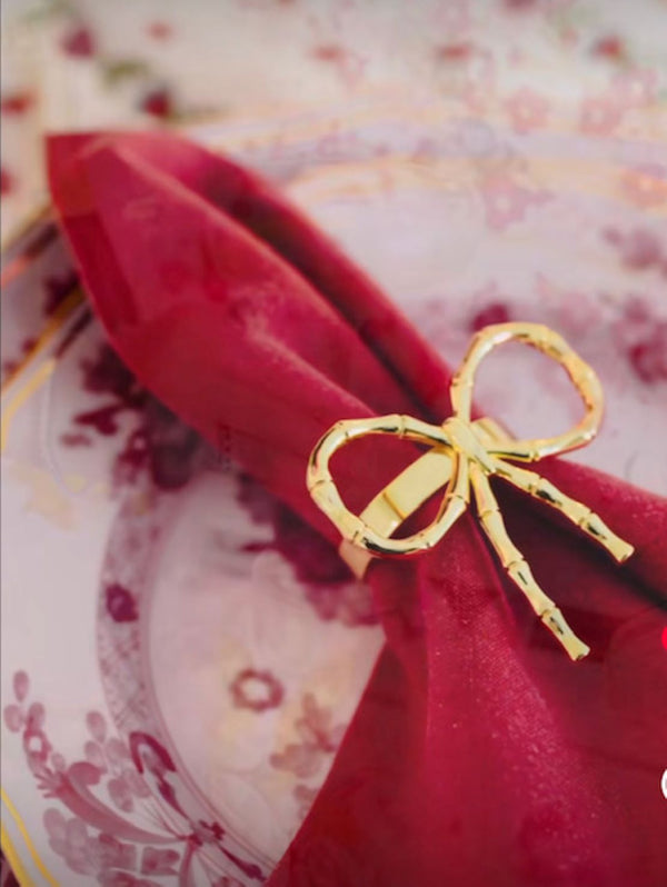 Gold Bow Napkin  Ring on Pink Ginori Plate
